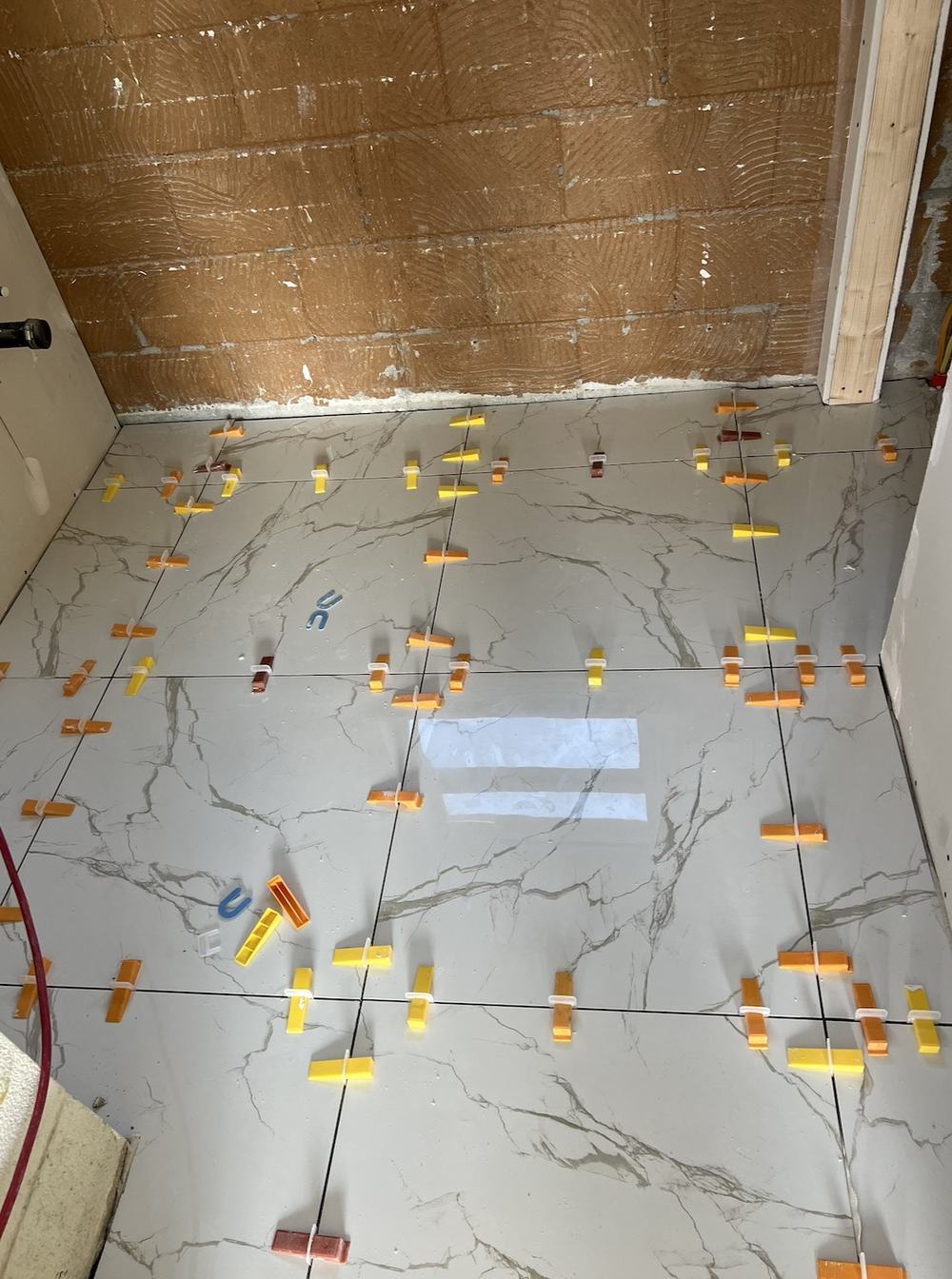 Precision tile installation during a Cavacor renovation